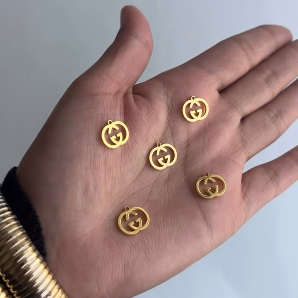 GG Interlocking Charms ā Gold & Silver Stainless Steel