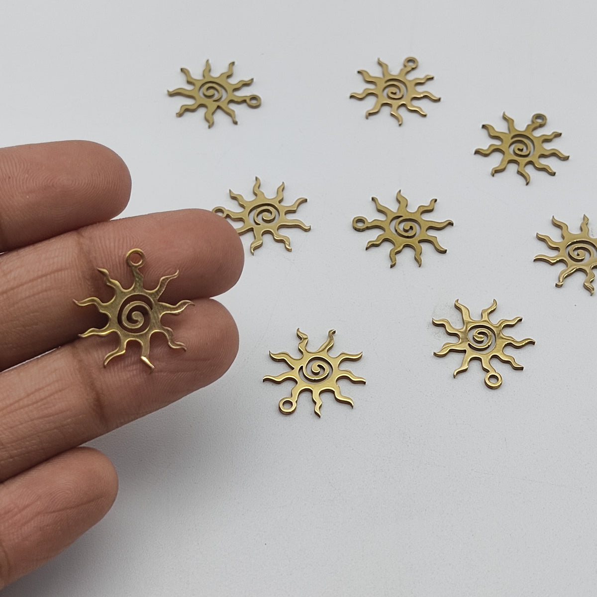 Stainless steel sun charm