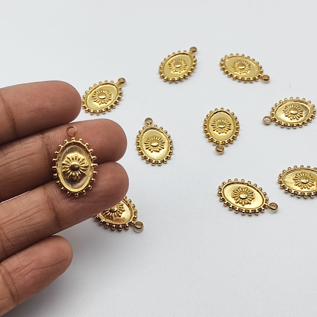 Stainless steel sun charm