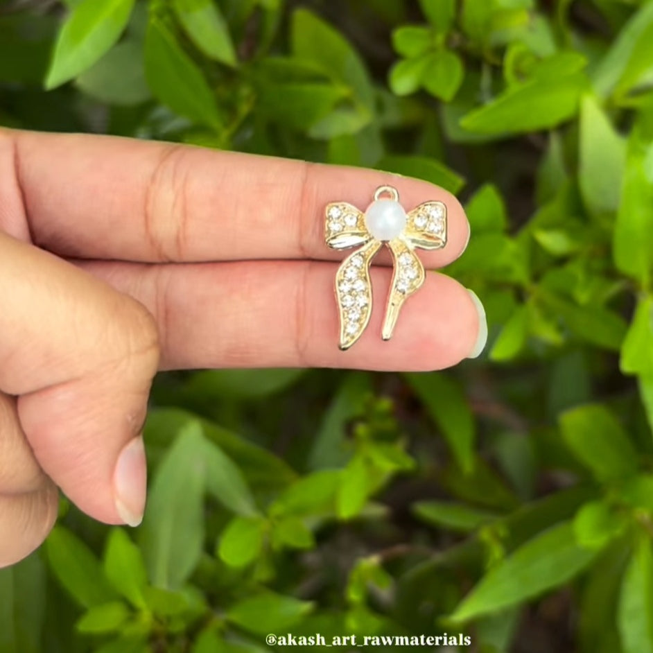 Golden bow charms