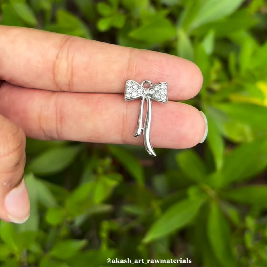 Silver bow charms