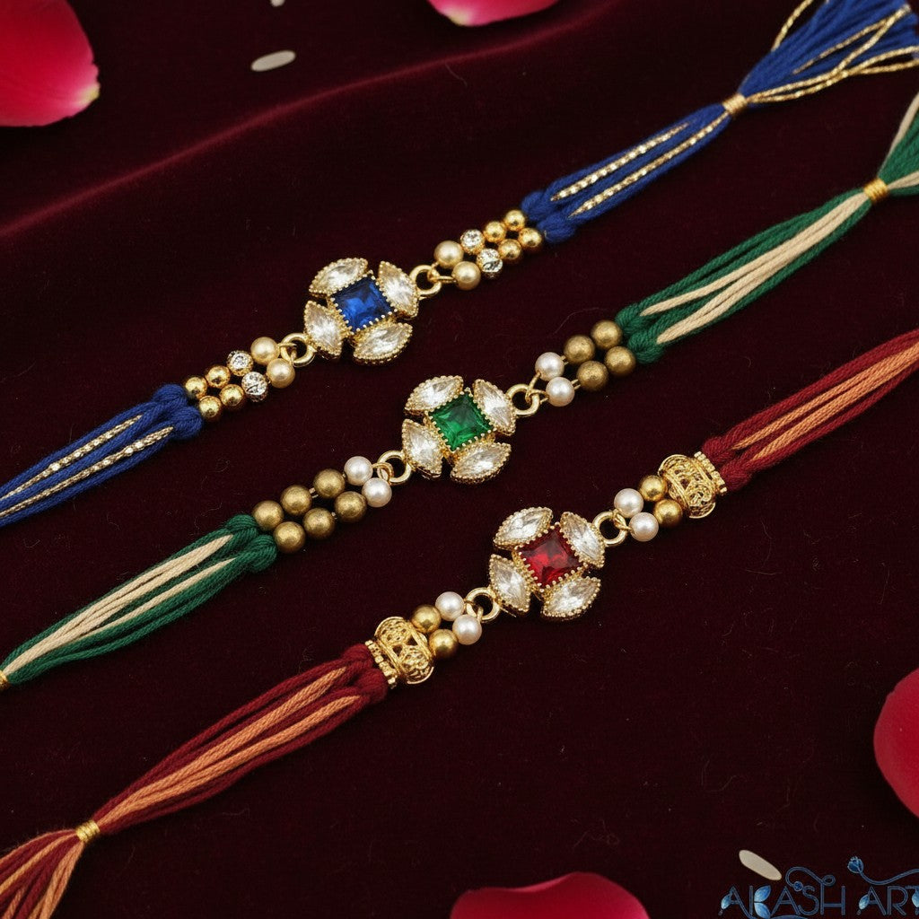 Akash Art Jewellers gold-tone alloy connector charms with blue, green, or red square crystals surrounded by clear marquise crystals.