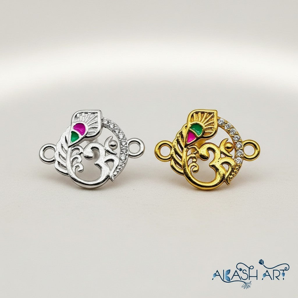 Akash Art Jewellers Om symbol peacock charm in gold and silver finishes with rhinestone crystals and enamel detailing.
