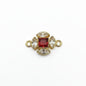 Akash Art Jewellers gold-tone connector charm with a central red square-cut crystal surrounded by clear marquise crystals.