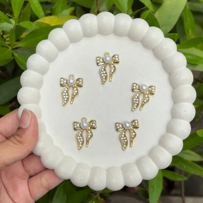 Golden bow charms