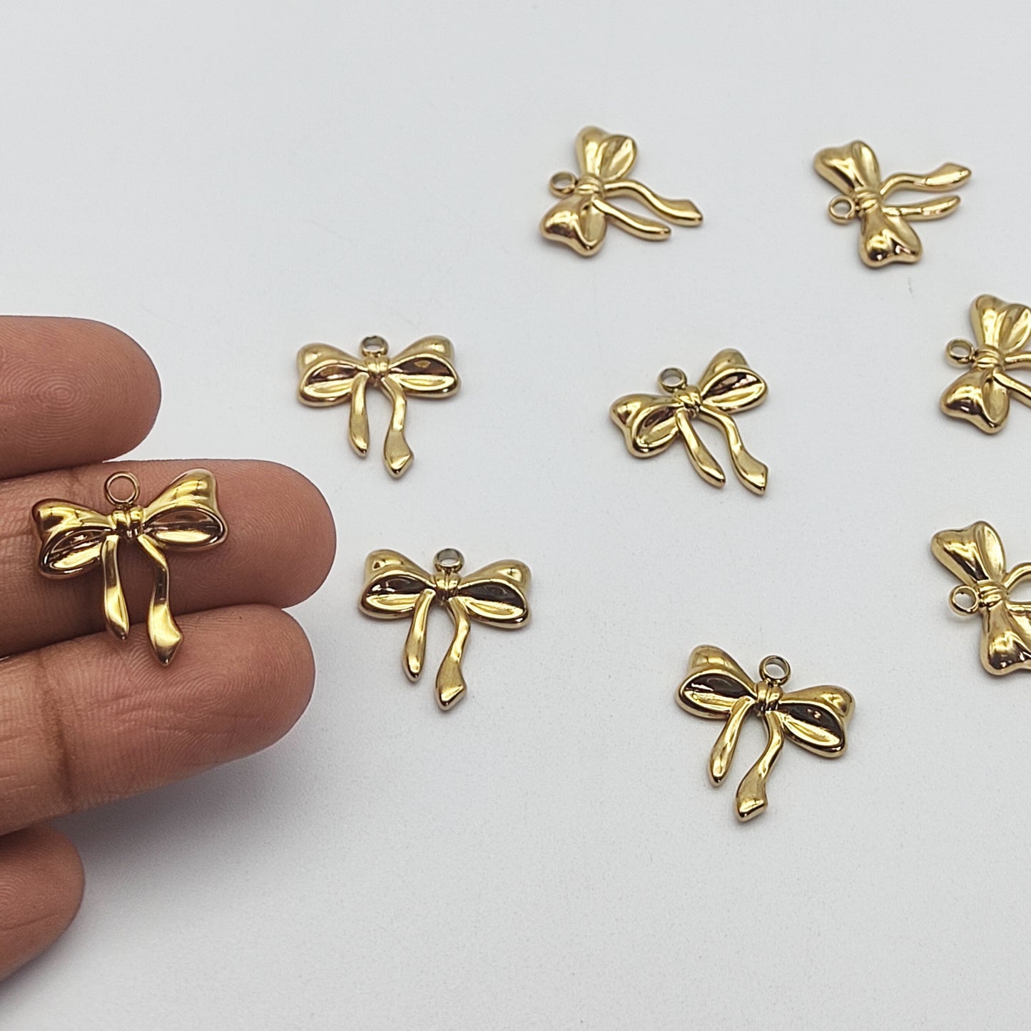 Stainless steel bow charm